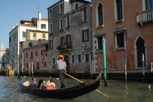 Gondolier with couple in Venice, Italy